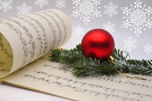 Music sheet with Christmas bulb